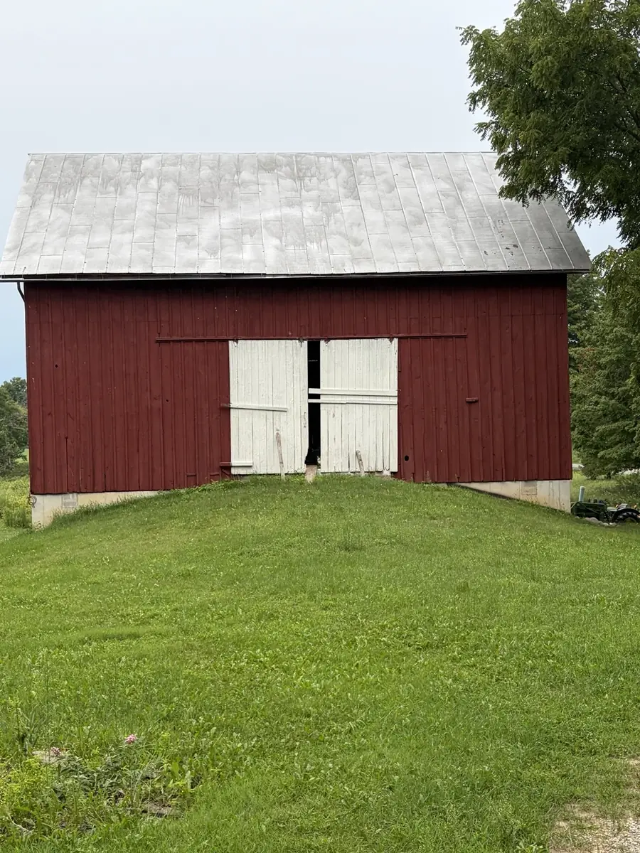 The real red Great Barn beneath a Michigan sky
